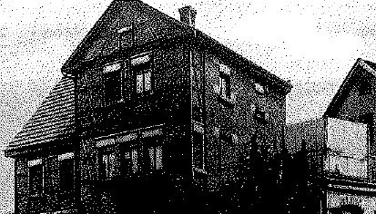 Altes Bauhaus in der Stadt, mit schlichtem Design und traditioneller Architektur.